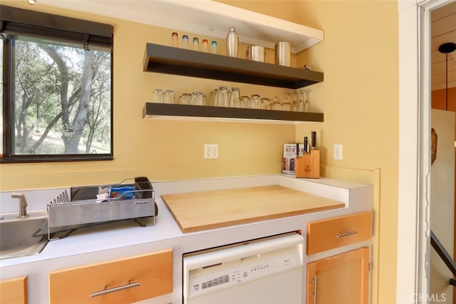 bar with dishwasher and a sink