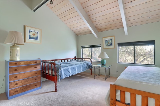 bedroom featuring wood ceiling, vaulted ceiling with beams, and carpet