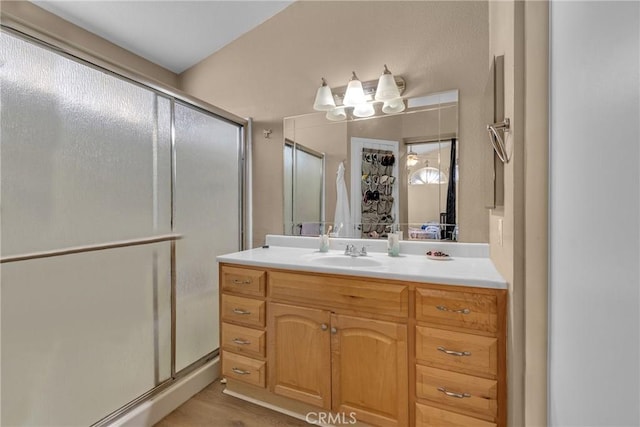 25351 Chicago Ave, Hemet, CA 92544 - full bathroom featuring a notable chandelier, vanity, and a stall shower