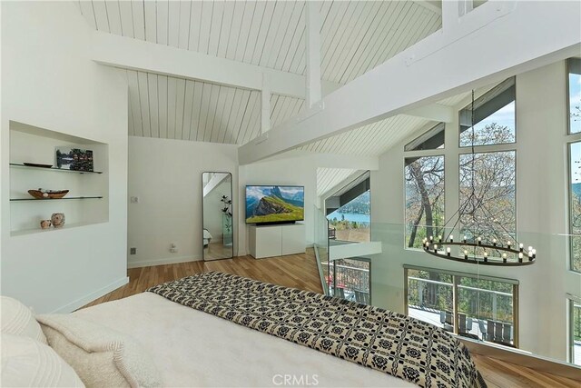 27637 St Bernard Ln, Lake Arrowhead, CA 92352 - living room with high vaulted ceiling, a notable chandelier, beam ceiling, and wood finished floors