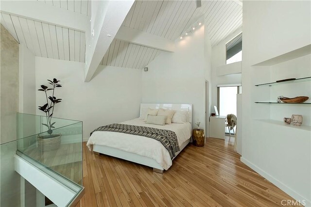 27637 St Bernard Ln, Lake Arrowhead, CA 92352 - bedroom featuring beam ceiling, wooden ceiling, baseboards, high vaulted ceiling, and light wood finished floors