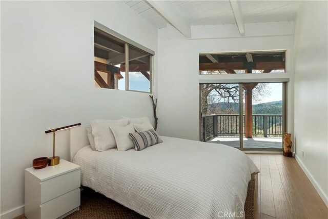 27637 St Bernard Ln, Lake Arrowhead, CA 92352 - bedroom featuring access to outside, beam ceiling, multiple windows, and wood finished floors