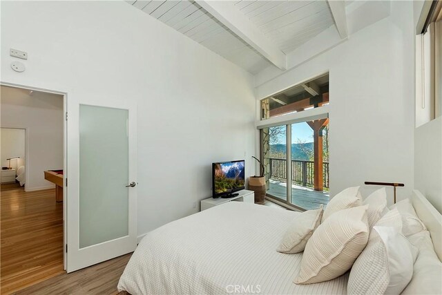 27637 St Bernard Ln, Lake Arrowhead, CA 92352 - bedroom with a high ceiling, beam ceiling, access to exterior, baseboards, and wood finished floors