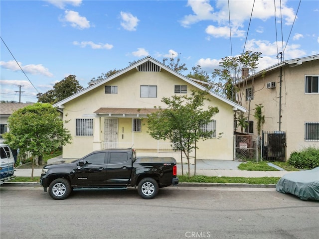 2619 Trinity St, Los Angeles, CA 90011 - view of front of property featuring stucco siding and a gate