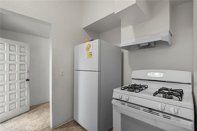 2619 Trinity St, Los Angeles, CA 90011 - kitchen with white appliances and premium range hood
