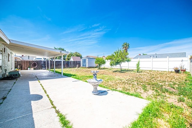 25176 Silent Creek Rd, Moreno Valley, CA 92553 - view of yard with a patio, a storage shed, an outdoor structure, and concrete driveway