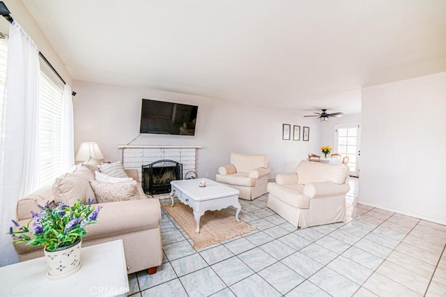 25176 Silent Creek Rd, Moreno Valley, CA 92553 - living area featuring a brick fireplace, a ceiling fan, and light tile patterned floors
