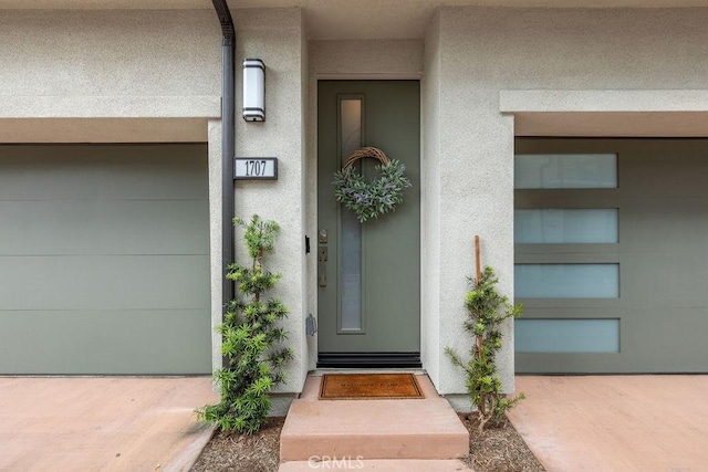 1707 W Bushell, Anaheim, CA 92805 - view of exterior entry featuring a garage and stucco siding