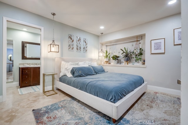 bedroom with recessed lighting, ensuite bath, and baseboards