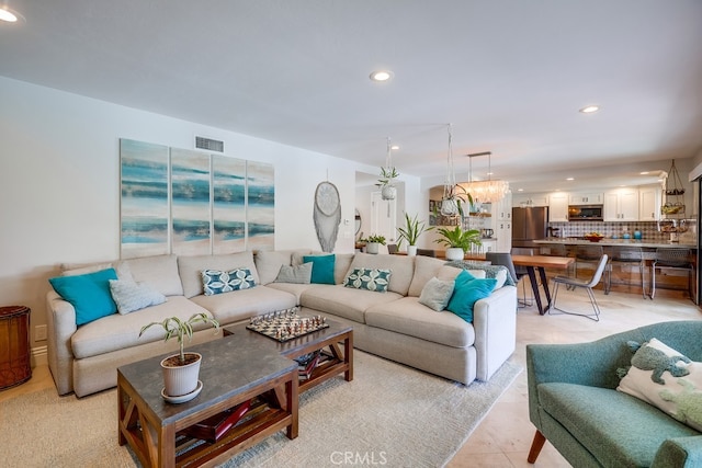 living room featuring visible vents, recessed lighting, and light tile patterned flooring