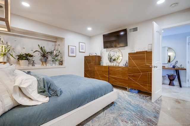 bedroom with visible vents and recessed lighting
