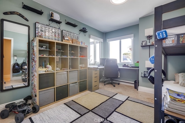 office space with baseboards