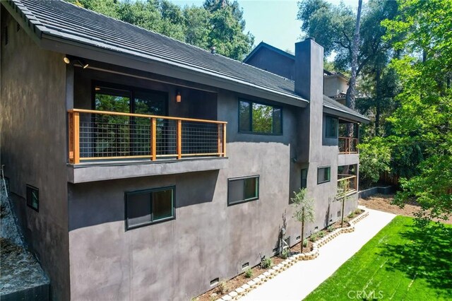 521 Fremont Dr, Pasadena, CA 91103 - view of home's exterior with a balcony, stucco siding, and crawl space