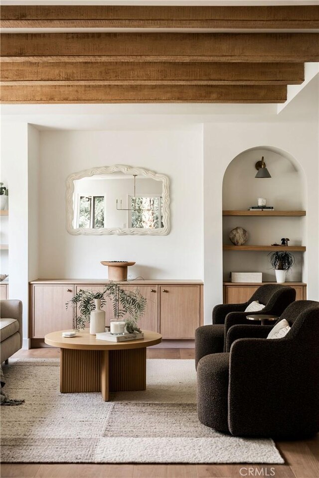 521 Fremont Dr, Pasadena, CA 91103 - living area with wood finished floors, built in shelves, and beam ceiling