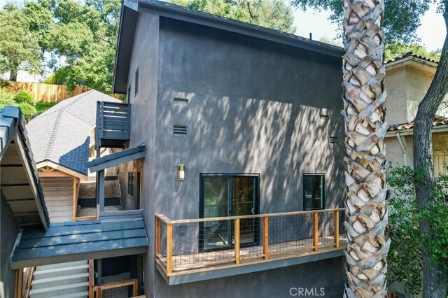 521 Fremont Dr, Pasadena, CA 91103 - back of house featuring stucco siding and a chimney