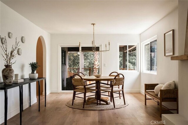 521 Fremont Dr, Pasadena, CA 91103 - dining area with arched walkways and wood finished floors