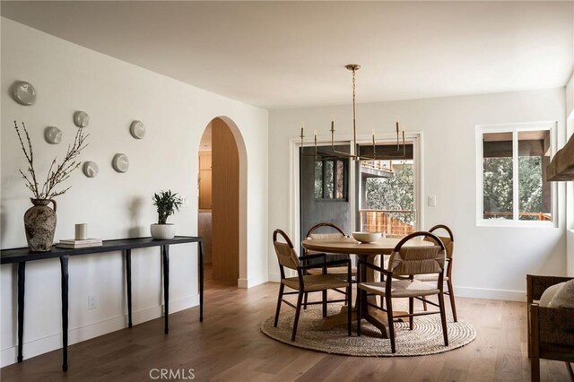 521 Fremont Dr, Pasadena, CA 91103 - dining space featuring arched walkways and wood finished floors