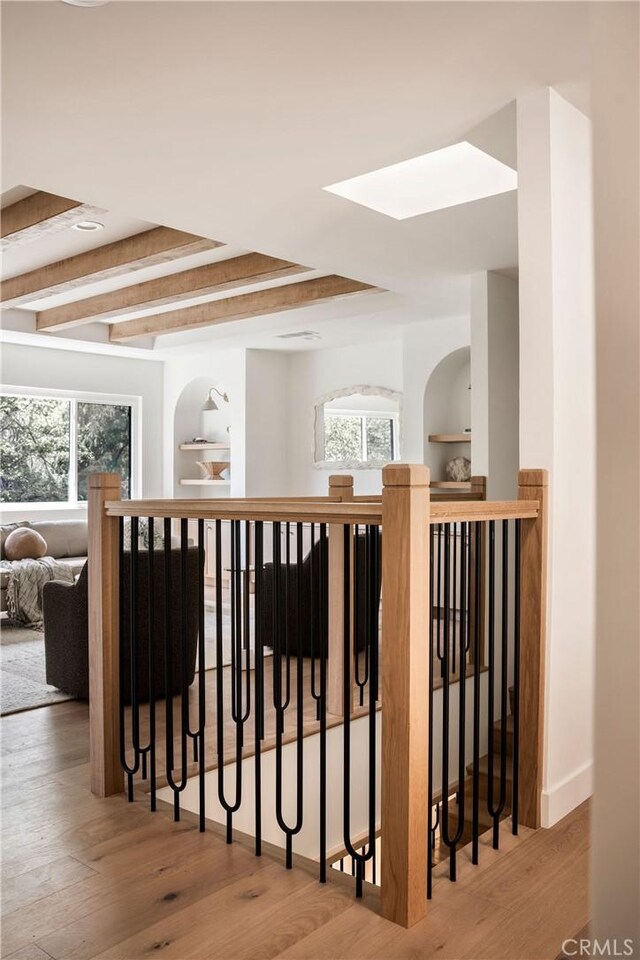 521 Fremont Dr, Pasadena, CA 91103 - hallway with wood finished floors, healthy amount of natural light, a skylight, and an upstairs landing