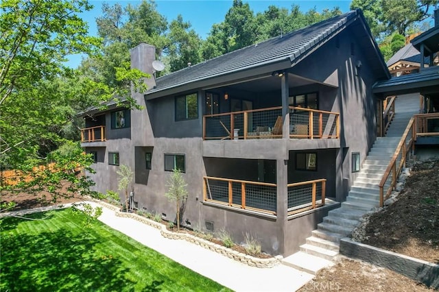 521 Fremont Dr, Pasadena, CA 91103 - back of house featuring a balcony, stairway, and stucco siding