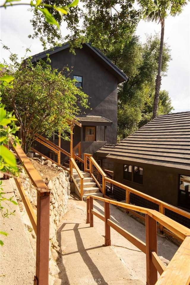 521 Fremont Dr, Pasadena, CA 91103 - back of house featuring stucco siding and a tile roof
