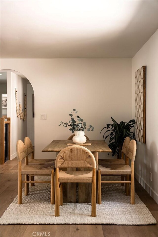 521 Fremont Dr, Pasadena, CA 91103 - dining area with arched walkways and wood finished floors