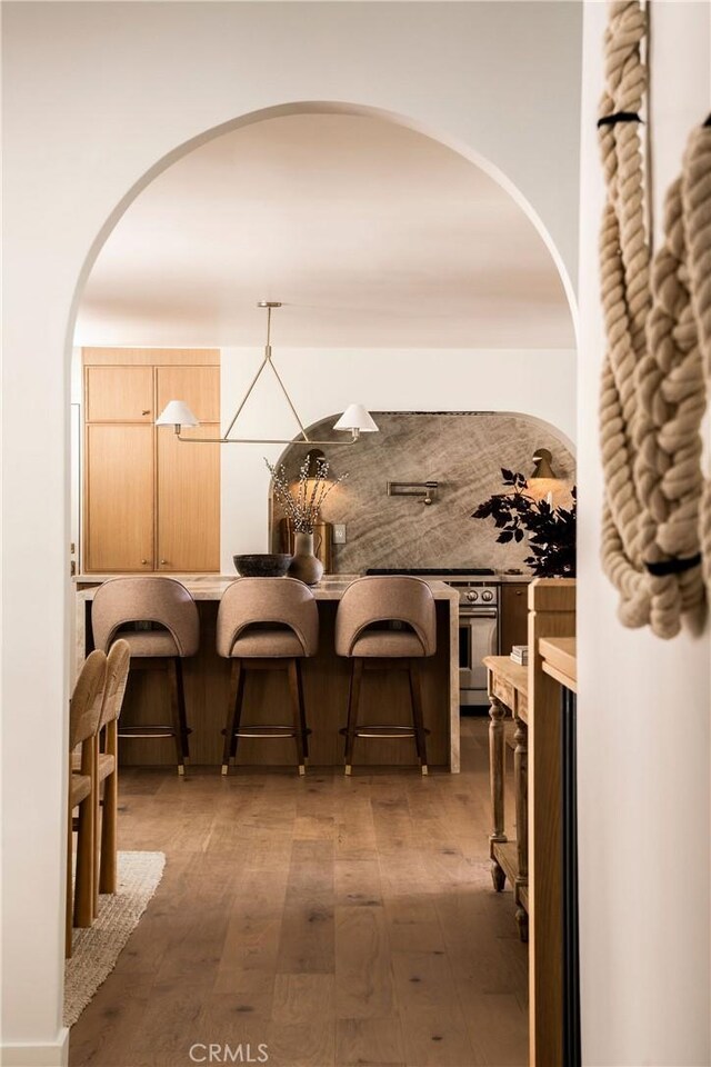 521 Fremont Dr, Pasadena, CA 91103 - dining area with hardwood / wood-style floors and arched walkways