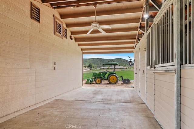 view of stable featuring a mountain view