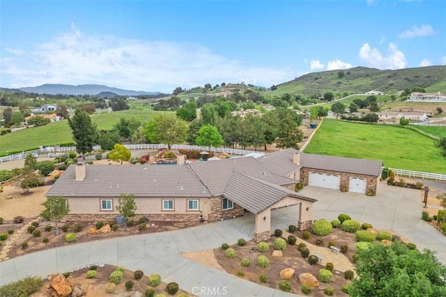 drone / aerial view featuring a mountain view