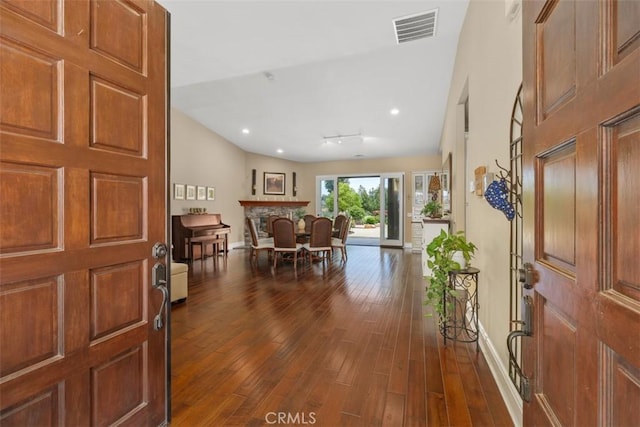 entrance foyer with baseboards, dark wood finished floors, visible vents, and recessed lighting