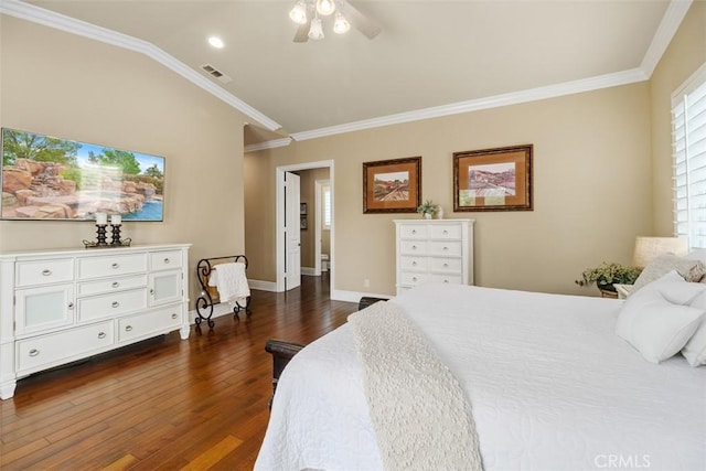 bedroom featuring dark wood-style flooring, vaulted ceiling, baseboards, visible vents, and crown molding