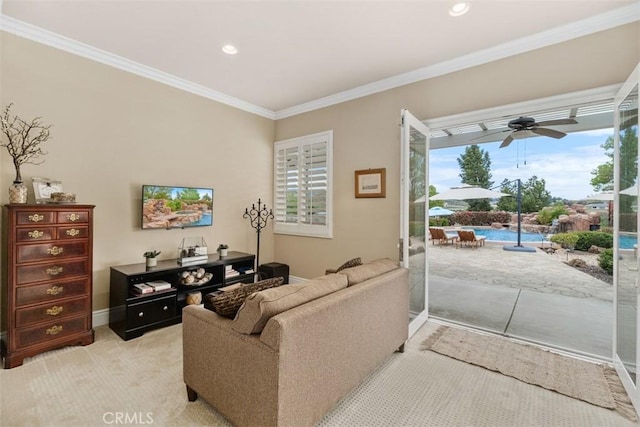 living area featuring a ceiling fan, baseboards, recessed lighting, and ornamental molding