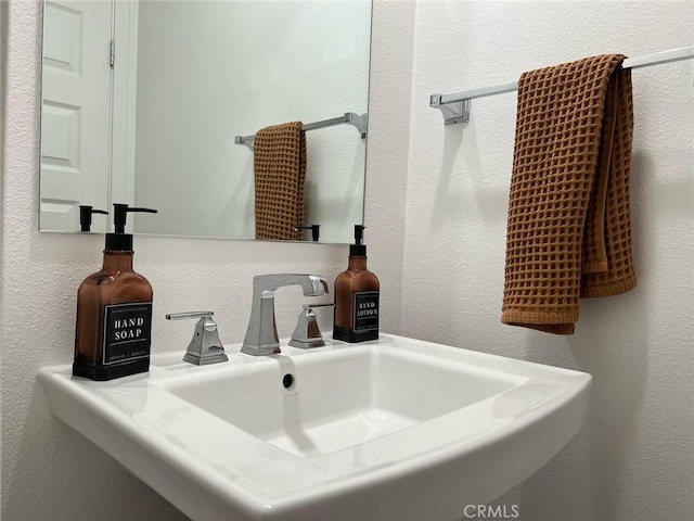 267 N N Magnolia Ave Unit 2, Anaheim, CA 92801 - bathroom with a textured wall and a sink