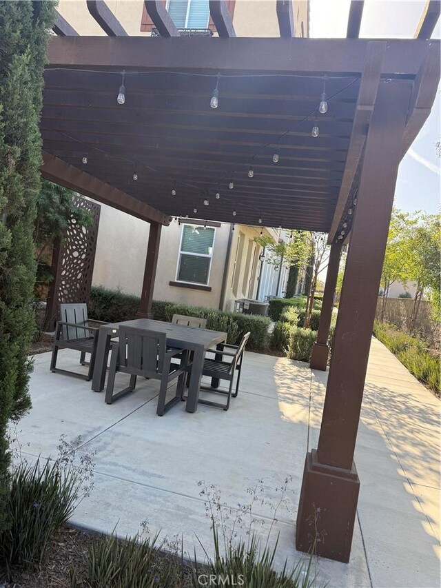 267 N N Magnolia Ave Unit 2, Anaheim, CA 92801 - view of patio with outdoor dining area and a pergola