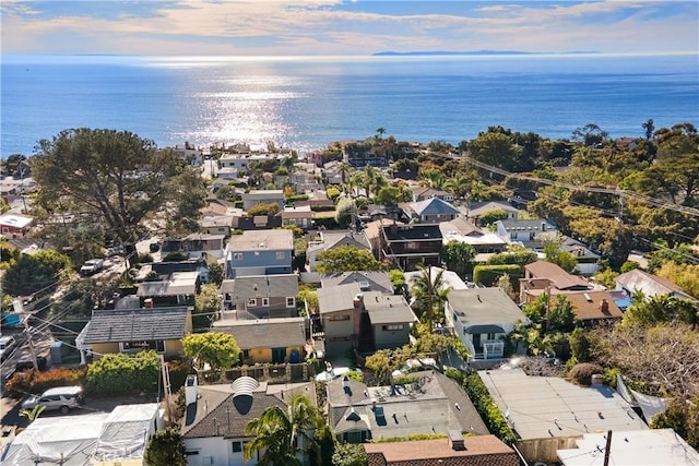 drone / aerial view with a residential view and a water view