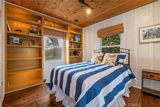 bedroom featuring wooden ceiling and dark wood-type flooring