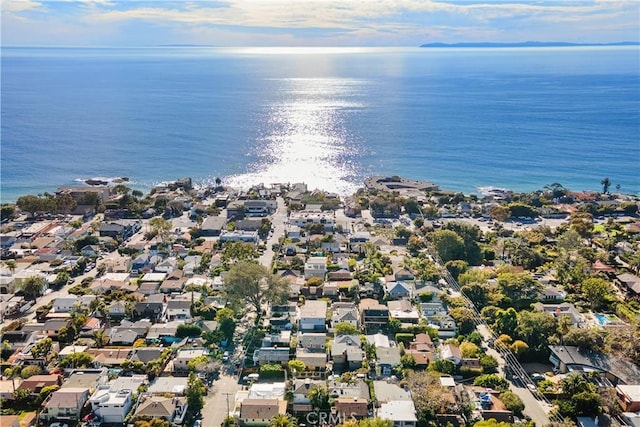 drone / aerial view with a residential view and a water view