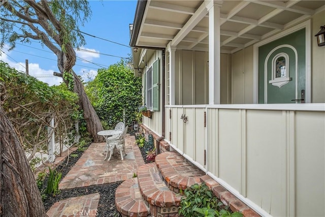 view of home's exterior featuring board and batten siding and a patio area