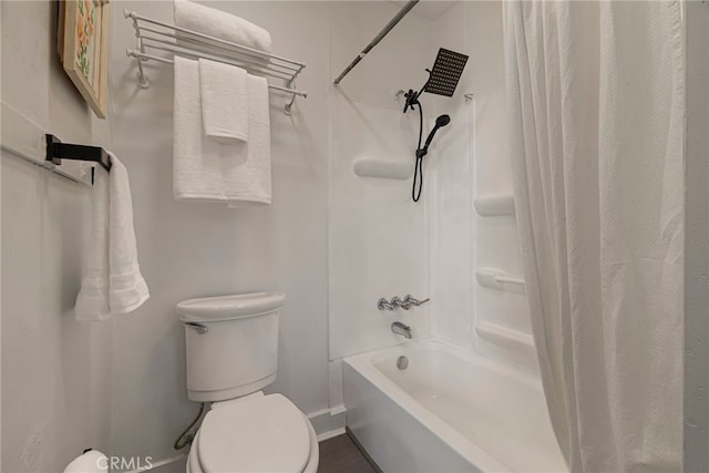 full bathroom featuring shower / bath combo, baseboards, and toilet