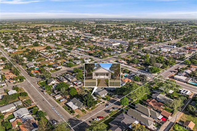 birds eye view of property with a residential view