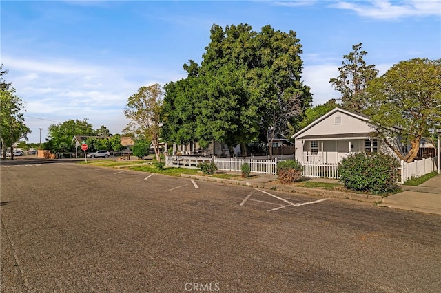 bungalow-style home featuring fence