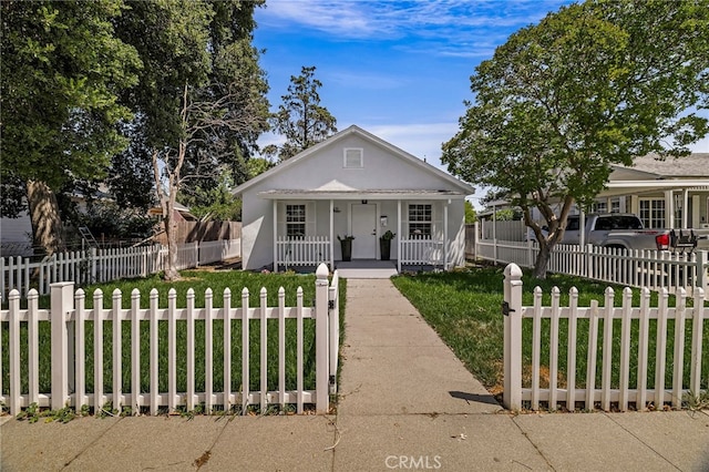 411 A St, Orland, CA 95963 - bungalow-style home featuring a porch and stucco siding