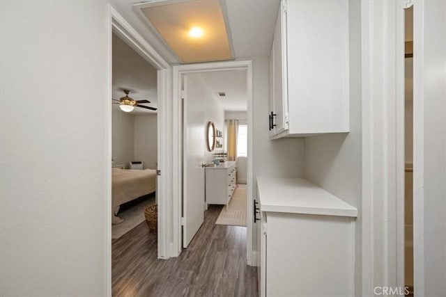hall with dark wood-style floors