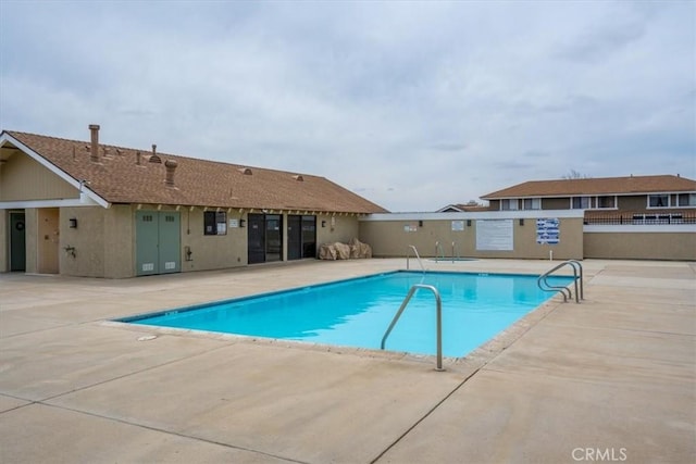community pool with a patio