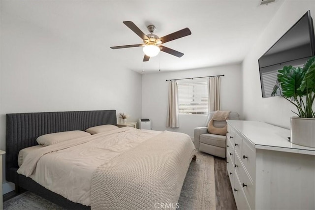 bedroom featuring wood finished floors and ceiling fan