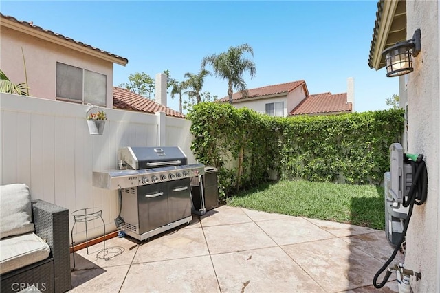 view of patio featuring area for grilling and a fenced backyard