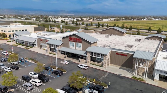 birds eye view of property featuring a mountain view