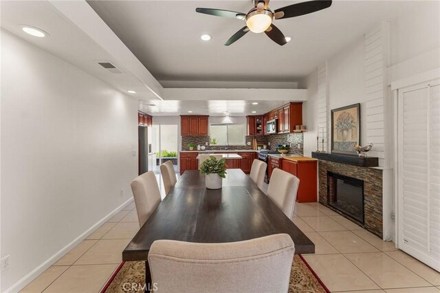 dining room with visible vents, light tile patterned floors, baseboards, a ceiling fan, and recessed lighting