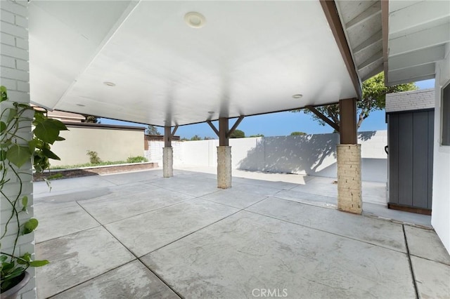 view of patio featuring fence