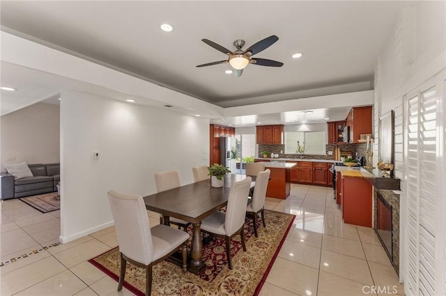 dining space featuring light tile patterned floors, baseboards, a ceiling fan, and recessed lighting