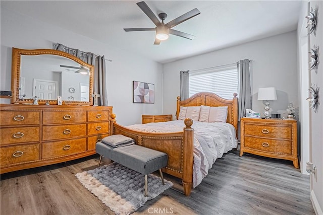 bedroom with ceiling fan and wood finished floors